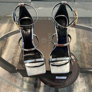 Brand New Versace Sandals Size 39. Comes with Box and Dust Bag.